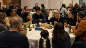 Residents discussing shared priorities around a participatory neighborhood planning table